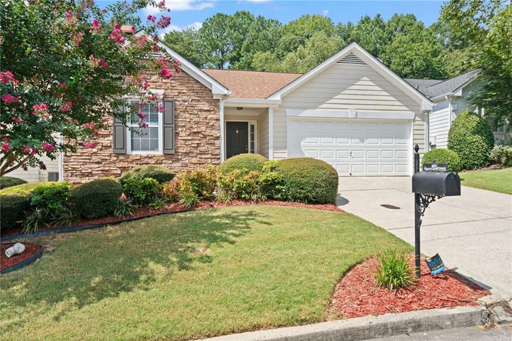 Newly renovated ranch home with private wooded backyard only 1 mile from Downtown Alpharetta! This lovely 3 BR / 2 BA home is conveniently located at the end of a quiet cul-d-sac walkable to nature trails, shops, restaurants, live music, and farmer's market in bustling Alpharetta, as well as districted for award winning Alpharetta public schools! When you arrive you are greeted by a separate foyer with dual hallway closeting, two separate guest bedrooms on the main, renovated guest bath and a new master bath bathroom with double vanity. One of the bedrooms would make a perfect office from home! The heart of the home opens to an open family room with cozy fireplace, separate dining room, and a light filled white kitchen with granite countertops and tile backsplash, stainless steel oven and range, stainless steel microwave, and separate pantry. Enjoy summer nights on the main level walkout patio with a private wooded view. Retreat to the oversized main level primary suite with tray ceilings, new ceiling fan, and spa-like primary bathroom with oversized walk in closet, tub, shower, and dual vanities. New interior paint throughout, new dishwasher. New lighting and plumbing fixtures throughout. Beautifully landscaped property. Pool use included. There is nothing like this offering on the market in this unbeatable location at a great price