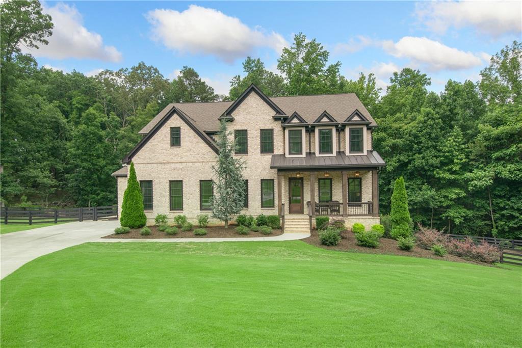 Tucked away on a quiet Milton cul-de-sac, this stunning modern farmhouse blends luxury and privacy with 3.3 acres. Wood beams, a wall of windows, and built-ins define the fireside family room, while the bright chef’s kitchen stuns with quartz counters, custom cabinetry, and a massive pantry.
Just around the corner, there’s a spacious drop zone—perfect for keeping life organized, with a cubby for everyone!
Upstairs offers the ultimate layout—three ensuite bedrooms, a media room, and a dreamy primary suite that feels like a retreat, complete with a spa bath and custom closet.
Step outside to a covered deck with fireplace, tongue & groove ceiling, and an in ground firepit perfect for smores.
All-brick exterior, cedar columns, and unbeatable location—just 2 miles to dining, shopping, and top schools. You couldn’t build this home today at this price—don’t let it slip away.
