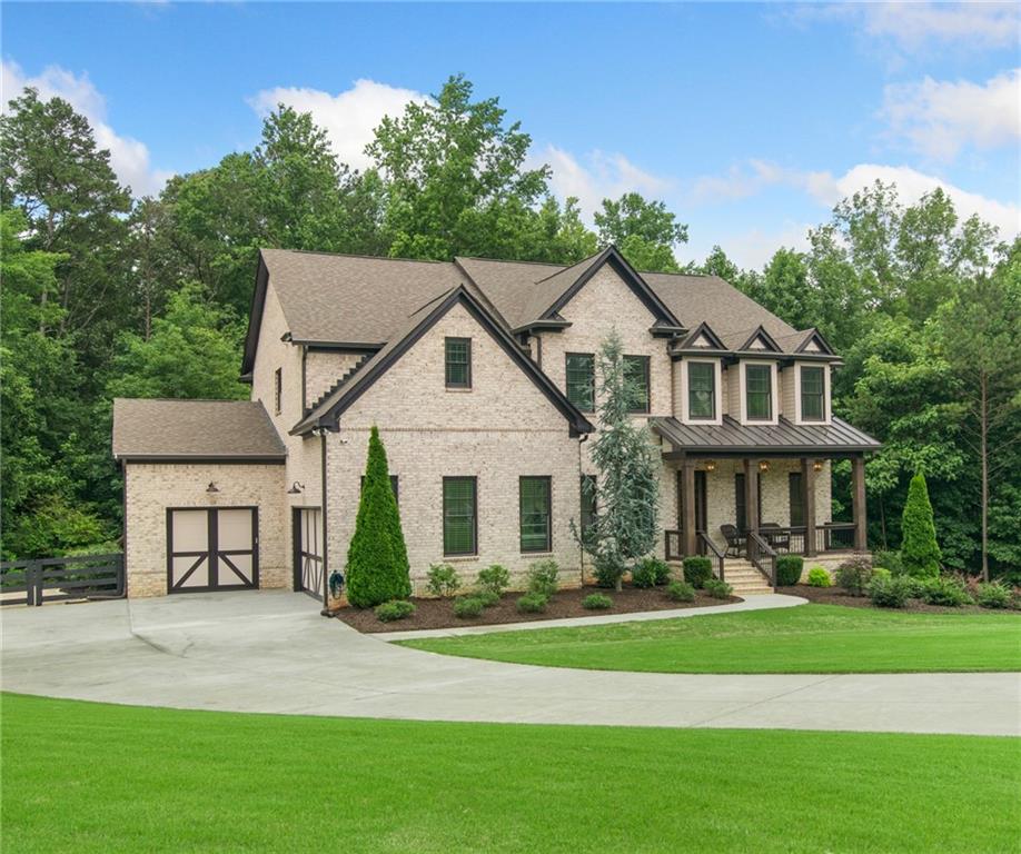 Dreaming of your own tennis court, basketball court, or just room to roam? This gorgeous Milton modern farmhouse sits on 3.3 acres at the end of a quiet cul-de-sac. Inside, soaring wood beams, a wall of windows, and custom built-ins frame the fireside family room. The bright, open kitchen wows with quartz counters, custom cabinetry, and a walk-in pantry. Around the corner, there’s a spacious drop zone—perfect for keeping life organized, with a cubby for everyone! Upstairs offers the ultimate layout—three ensuite bedrooms, a media room, and a dreamy primary suite that feels like a retreat, complete with a spa bath and custom closet. Step outside to a covered deck with fireplace, tongue & groove ceiling, and an in ground firepit perfect for smores. All-brick exterior, cedar columns, and unbeatable location—just 2 miles to dining, shopping, and top schools. You couldn’t build this home today at this price—don’t let it slip away.