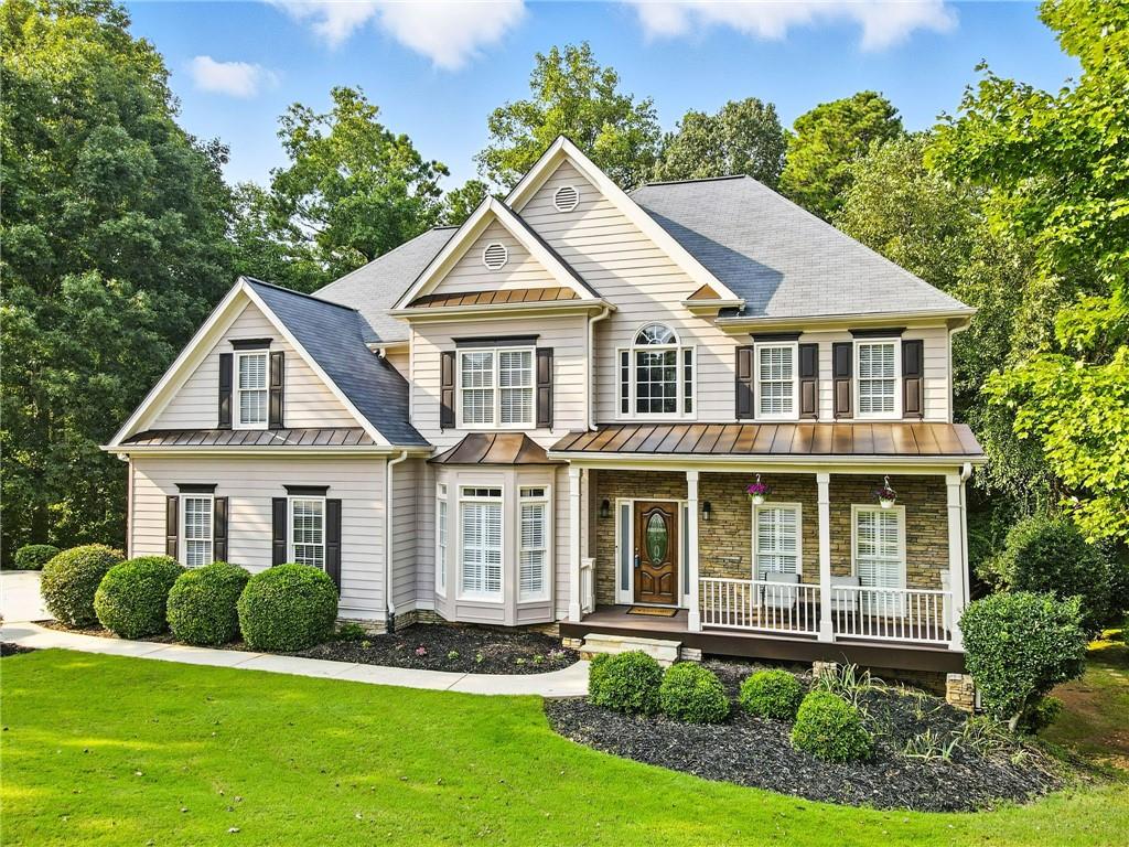 Beautifully situated BridgeMill home less than 1 mile from the main entrance that backs up to Corps of Engineer property and Lake Allatoona. If you enjoy nature and being outdoors, you’ll love the ability to walk through the backyard and woods to the lake. Family hikes, fishing at the lake, enjoying the wildlife and nature is one of biggest advantages of this home. Being so close to the BridgeMill entrance you can walk to Publix, restaurants, CVS, banks and even all the amenities that BridgeMill offers, such as the 2 acre resort style pool, playground and sand volleyball courts. You have not even stepped inside the home yet! Upon entering you will find hardwoods throughout the main floor, private office or den, separate dining room, 2 story living room with fireplace, updated kitchen, kitchen nook, bedroom on the main level with full bath, laundry room and spacious rear Trek-style deck overlooking all the beautiful woods. Heading upstairs you will find the oversized primary bedroom with a large bathroom. The primary bathroom has a tile walk in shower, soaking tub, double vanities, double closets and private toilet room. There are 3 additional secondary bedrooms and 1 more full bathroom. That’s a lot of house already! Head down to the finished terrace level and you will find ideal entertaining space for games and all sorts of other activities along with a 6th-bedroom and 4th full bathroom, wet bar and access to the large, covered patio with under-deck drainage so it stays dry when it rains. From here you can enjoy the backyard and head into the woods for a walk to the lake. The optional BridgeMill Athletic Club is a resort-style golf, tennis and country club in Canton, Georgia. The Golf Course is semi-private and features an 18-hole championship course with state-of-the-art practice facilities and driving range. The 25-court Tennis Center is one of the largest facilities in the Atlanta area and boasts championship ALTA and USTA teams as well as an outstanding Junior Tennis program. There are also 10 pickleball courts. Two of the most attractive aspects of Membership are Pool and Fitness/Wellness Center usage. The Club’s Fitness Center offers commercial gym-quality equipment in a relaxed environment with a full schedule of group fitness classes to fit a wide range of schedules and abilities. Members enjoy fun activities for children as well as adults, ranging from Pool Parties to Dive-In Movies, BBQ’s, Holiday Events, Kids’ Camps, Playground, Park Area, Pavilion, Sand Volleyball and Basketball Courts.
