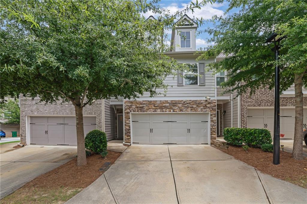Welcome to this beautifully maintained and like-new townhome located in the City of Tucker—just minutes from everything Tucker, Stone Mountain, and the surrounding areas have to offer. Whether you’re commuting into the city, enjoying local parks, or grabbing dinner nearby, the location is unbeatable.
Step inside to find a light-filled open-concept main level with tall ceilings, sleek engineered flooring, and a seamless flow from the living area to the kitchen. The spacious family room features a cozy fireplace—perfect for gathering or unwinding—and opens to a modern eat-in kitchen designed for both everyday living and entertaining. Enjoy stainless steel appliances, stone countertops, a stylish tile backsplash, an oversized island with seating, and generous cabinet space including a walk-in pantry.
Upstairs, a flexible loft area provides the perfect bonus space for a home office, reading nook, or play area. The large primary suite is a true retreat with a tray ceiling, walk-in closet, and spa-style ensuite bath featuring a dual vanity, garden tub, and separate tile shower. Two additional bedrooms, a full hall bath, and a convenient upstairs laundry room round out the second level.
Outside, step onto your private patio with a fenced backyard—ideal for relaxing with your morning coffee, grilling with friends, or letting pets play freely.
Additional perks include a 2-car garage with direct entry, low-maintenance living with exterior upkeep handled by the HOA, and easy access to Stone Mountain Park, Hwy 78, I-285, shopping, dining, and more.
This is the one you've been waiting for—modern, move-in ready, and low-maintenance with thoughtful touches throughout. Come see it for yourself!