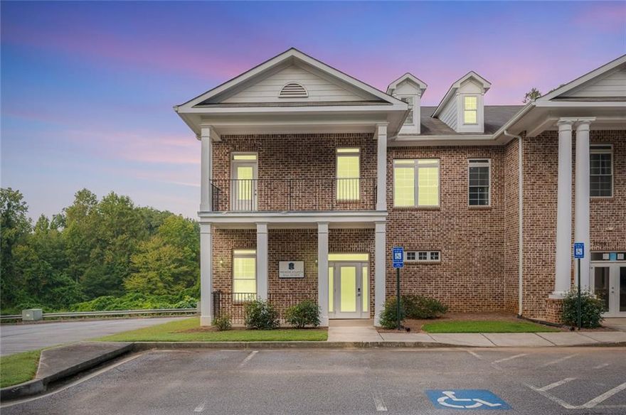 Positioned between North Point Mall and Avalon with immediate access to GA-400, this professional office suite offers the space, layout, and location ideal for business owners ready to establish or grow their presence in Alpharetta. The property includes both the main level and fully finished basement-leased together for a combined  2,400 square feet. The main level features four private offices, a reception area, a dedicated bathroom, and a kitchenette, all with high ceilings and excellent natural light. The lower level provides flexible space perfect for team meetings, training, or additional work areas, with a separate entrance for added functionality. Ample on-site parking, well-maintained landscaping, and front and rear entry points complete the package. Whether you're in legal, financial, tech, or medical services, this space is designed to support day-to-day operations in a location that connects you to Alpharetta's business and lifestyle centers.