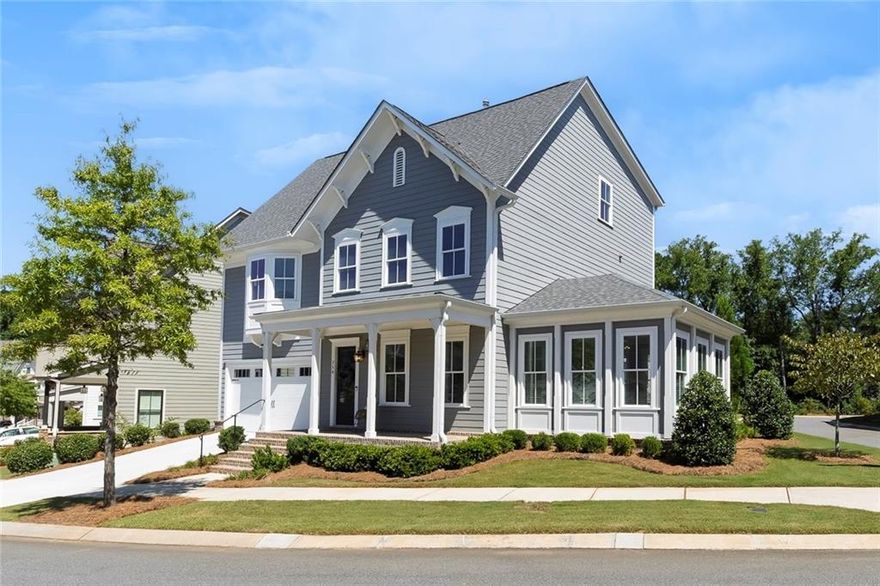 This is the home and lifestyle you’ve been dreaming of. Perfectly situated on a coveted corner lot, this single-family residence offers one of the largest backyards in South on Main, right in the heart of Woodstock. The location is unbeatable—just steps from shops, restaurants, concerts at the Amphitheater at City Center, world-class productions at Woodstock Arts, the Greenprints Trail system, the downtown farmers market, and so much more. Designed with both comfort and style in mind, the open-concept main level is filled with natural light and features a welcoming family room with fireplace, a spacious dining area, and a chef-inspired kitchen complete with abundant cabinetry, quartz countertops, a center island with seating, top-of-the-line stainless steel appliances, and a large pantry. From here, enjoy direct access to the covered rear patio, perfect for grilling or relaxing while overlooking the beautifully landscaped, fenced backyard—a rare find in this community. A vaulted sunroom offers a flexible space for lounging or a home office, while a convenient guest bedroom and full bath complete the main floor. Additional thoughtful details include a drop zone off the two-car garage for everyday ease. Upstairs, the generous owner’s retreat is a true sanctuary with a spa-like bath featuring double vanities, a soaking tub, a glass-enclosed walk-in shower, and a large walk-in closet. Two additional bedrooms share a connecting bath, and a well-equipped laundry room with sink and storage adds convenience. The third level offers even more flexibility with a bonus room ideal for game day or movie nights, plus an additional bedroom and full bathroom. Life at South on Main is second to none. This premier community features 20 acres of green space and parks, a community garden, firepit, resort-style swimming pool with splash pad and cabana, and a 6,000-square-foot clubhouse with fitness center, game room, and conference space. Residents also enjoy two dog parks, a play park, an open-air pavilion, “The SHED” stage for events, and direct access to the Noonday Creek Trail, part of the expansive Greenprints system. All of this is just moments from the vibrant energy of Downtown Woodstock and minutes from I-575 for an easy commute to Atlanta and beyond. Discover why South on Main and Woodstock remain among North Georgia’s most sought-after destinations—this home truly offers it all.