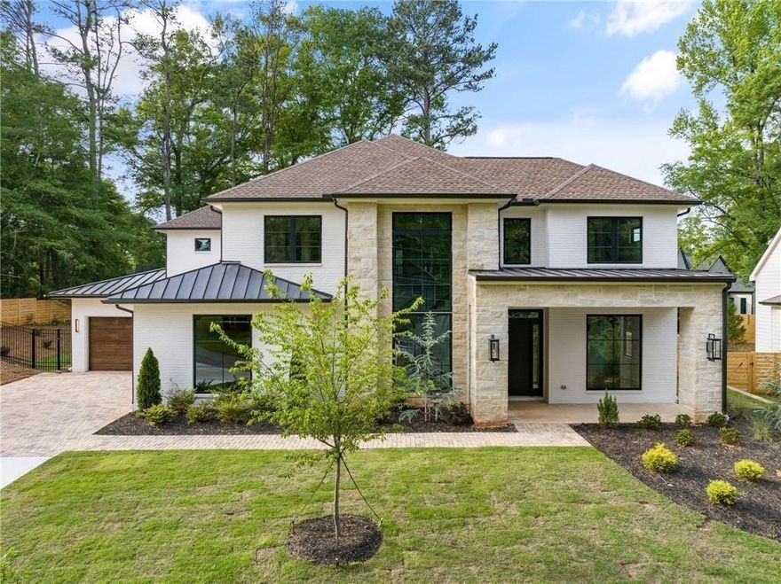 Nestled just steps away from Downtown Alpharetta, this stunning 5-bedroom, 5.5-bathroom home boasts a sophisticated exterior adorned with charming gas lanterns, expansive Anderson 100 Series windows and a immaculate porch wrapped in stone. This beauty offers an exceptional blend of indoor and outdoor living spaces, with ample room for a future POOL. Step inside to discover an open layout, starting with an impressive staircase flanked by floor-to-ceiling windows, a versatile bedroom/office with a full bathroom, and a spacious family room filled with natural light at every corner. Entertain effortlessly in the open dining area, chef's kitchen, and covered outdoor lounge featuring elegant limestone flooring. The kitchen is a chef's delight, showcasing custom-built European cabinets with Blum hardware, topof-the-line appliances, and topped off with gorgeous counters. A matching quartzite backsplash and walk-in custom pantry add to the allure or this spacious kitchen. Retreat to the owner's suite, boasting a spa-like bathroom featuring a lavish wet room with a soaking tub, and exquisite tile details. The double vanity, large custom closets, and private water closet complete this luxurious retreat. Upstairs, three
secondary bedrooms await, each boasting private en-suites and walk-in closets. Outside, enjoy the sprawling walk-out flat backyard, perfect for outdoor gatherings. Conveniently located within walking distance to the vibrant array of restaurants, shops, and boutiques in downtown Alpharetta, and just minutes away from Avalon and the North Point Area, this home offers the epitome of luxurious suburban living. This home is only a few steps from Downtown Alpharetta it's the next hidden gem tucked away for privacy but in the heart of everything. You won't find a more convenient location!! Approved Pool Permit in hand!