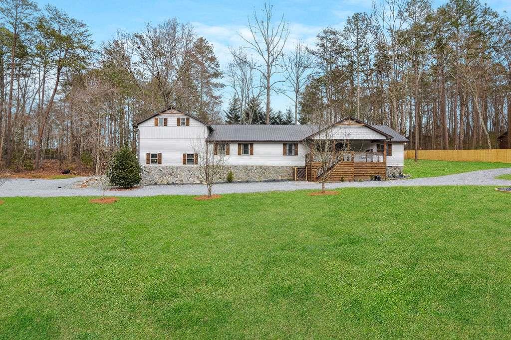 Gorgeous Luxury home located only 2 miles from downtown Blue Ridge and 1 mile from Lake Blue Ridge and Marina. Boasting 5 bedrooms and 4 full bathrooms, this newly renovated home has it all! Whip up cost-saving breakfasts, lunches, and dinners in 2 well-equipped, chef ready full kitchens. Dine indoors at the large table for eight or outdoors on your furnished deck, complete with a gas grill. Gather together in the cozy living area, warmed by a gas fireplace. Enjoy shooting some pool, foosball, shuffleboard or watch a movie on the large 75" smart tv in your own game room equipped with a jukebox for your listening enjoyment or spoil yourself outside in your very own six-person hot tub. Want to enjoy nature, build a fire and soak it in with an amazing fire pit with wood provided. With plenty of parking and the marina nearby bring your boat and enjoy lake Blue Ridge and all it has to offer. Amazing location for your forever home or an excellent income producing asset! Schedule your showing today!