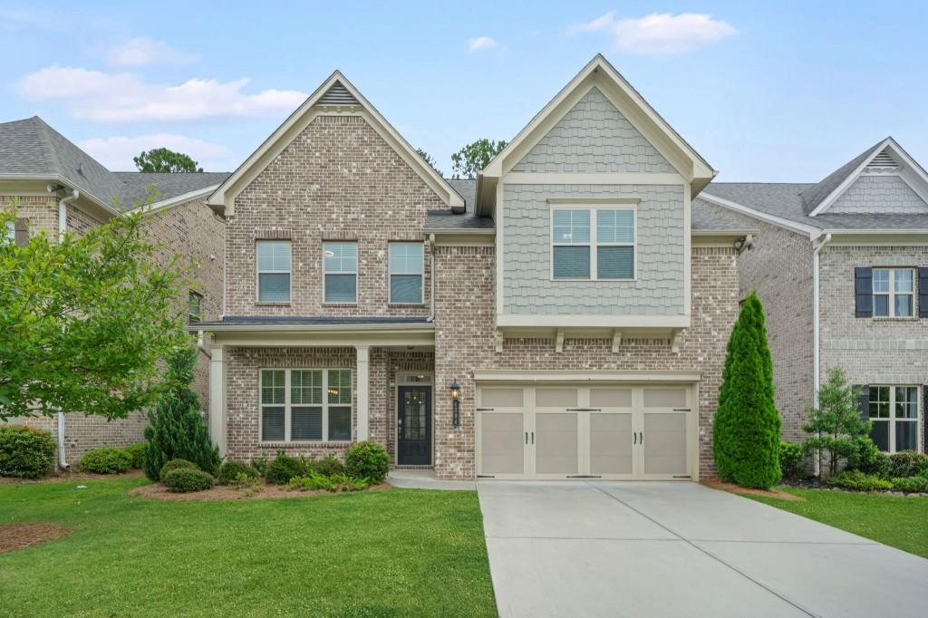 This beautiful 4-bedroom, 3.5-bath home checks all the boxes! The main level boasts soaring 10-foot ceilings, a formal dining room, and an open-concept kitchen and living area, perfect for entertaining or everyday living. The chef's kitchen features quartz countertops, a tile backsplash, stainless steel appliances, double ovens, a prep island, an expansive peninsula, under-cabinet lighting, and abundant storage. The living room centers around a cozy fireplace flanked by custom built-ins and flows seamlessly to a private backyard and patio; plus, the HOA handles all yard maintenance for truly easy living! The main-level primary suite is a retreat with a tray ceiling, two walk-in closets with custom organization systems, and a spa-like bath. Upstairs, 9-foot ceilings enhance the airy feel of a versatile loft space. A large bedroom with an en suite bath is perfect for guests, while two additional bedrooms share a jack-and-jill style bath that also connects to the loft. A massive bonus/flex room offers endless possibilities and could be an office, gym, playroom, or even a fifth bedroom. Collection at Perimeter Park offers fantastic amenities, including a pool, gym, and playground, and is conveniently located near downtown Chamblee, Dunwoody, Brookhaven, and major highways for easy commuting.