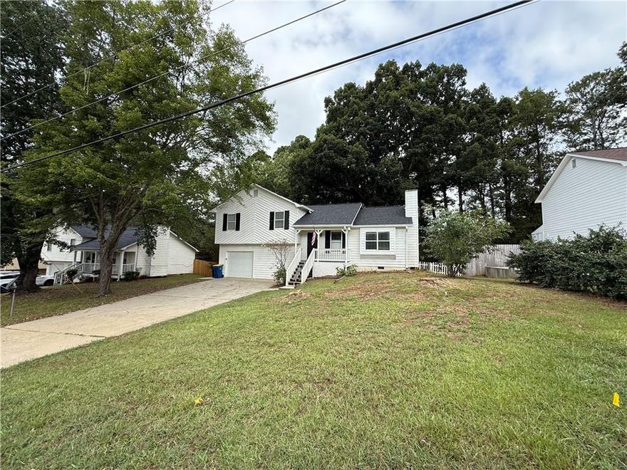 This welcoming Kennesaw home in Stilesboro Cove offers the complete package-value, convenience, and comfort-all in the desirable Kennesaw Mountain High School district.  Inside, you'll love the functional three-bedroom, two-bath floor plan designed for everyday living. The bright and freshly painted interior feels clean and move-in ready. A cozy great room with fireplace sets the tone for both quiet evenings and lively gatherings. The separate dining room is ideal for family meals, game nights, or even a home office.  Step outside to a shady, rocking-chair back porch-your new favorite spot for morning coffee or relaxing afternoons perfect for weekend cookouts, while the oversized garage provides excellent storage plus a convenient side-entry door.  Close to shopping, dining, and major highways, this home is not only a smart buy-it's the lifestyle upgrade you've been waiting for.  Don't wait. Come see it today and make it yours!