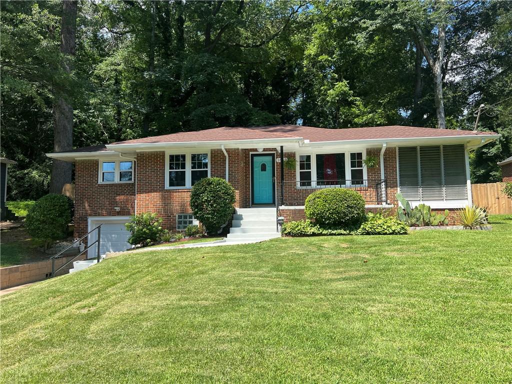 Charming Brick Ranch Retreat Near the Beltline!
Welcome to your next home sweet home—a beautifully maintained brick ranch nestled on nearly half an acre of land! Step inside and immediately feel the warmth as natural sunlight pours through brand-new windows, dancing across the original re-finished hardwood floors that add timeless character. Whether you're hosting game night in the spacious dining room or whipping up your favorite dishes in the cozy, functional kitchen, this home is made for memory-making. Mornings are better with coffee in the fully screened sunroom, and evenings are perfect for sipping sweet tea or lemonade as the sun sets. New worry free windows. Fresh paint throughout on all walls and ceilings. Kitchen and laundry room with new LVP flooring. One car garage basement currently used as an artists studio with a 220 v outlet for the future tinkerers workshop. Located just minutes from the Westside Beltline and the buzzing Lee + White Food Hall, you’re steps from Atlanta’s hottest breweries—including Monday Night Garage, Boxcar, Wild Heaven, Best End Brewing, and Boggs Social. Plus, with quick access to Downtown Atlanta, East Point, the Delta Campus, and Hartsfield-Jackson Airport, your commute has never been easier. Don’t miss this rare gem in a location that truly has it all—space, charm, and unbeatable convenience. Schedule your showing today… this one won’t last!