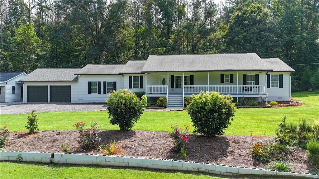 Enjoy peace and tranquility with your morning coffee on the porch swing, or unwind at the end of a long day while taking in the view of a beautiful, well-maintained yard.
This charming home offers 3 bedrooms and 2 full bathrooms and was built in 2015, reflecting pride of ownership and a love for nature. With 2,147 square feet of living space, there's room to relax and entertain — plus ample outdoor space to park your RV, boat, or store your other toys and work equipment.
Located in Cartersville, a town that strikes the perfect balance between small-town charm and big-city convenience, you'll enjoy a growing job market, great schools, and a vibrant community. And when you're ready to explore, you're just a short drive from Lake Allatoona, Red Top Mountain State Park, and Pine Mountain.