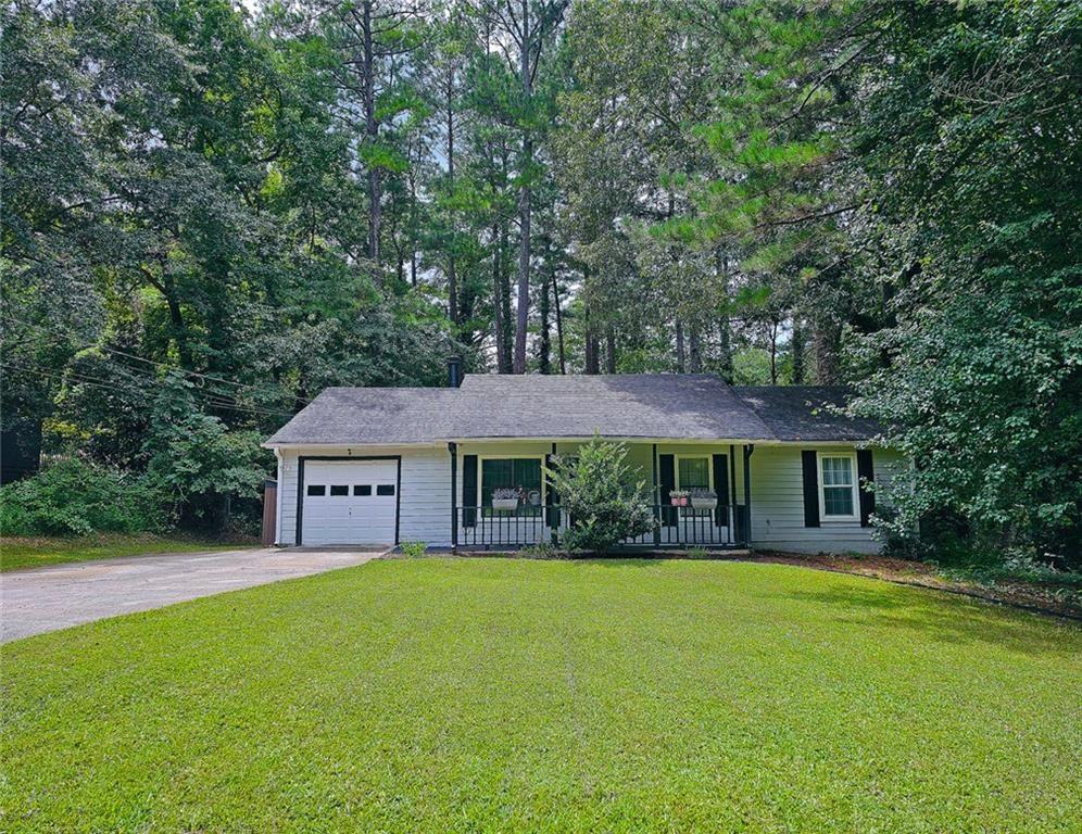 Welcome to Ridgemoor Subdivision! This open concept home features a huge family room with fireplace for all your entertainment needs. Dining area opens to a great kitchen with granite countertops and stainless steel appliances with eat-in breakfast area. Pantry has new shelving for maximum organization. There are 3 large bedrooms and 2 full bathrooms on a quiet private street in the cul de sac on almost 1/2 acre. Enjoy this ready to move in home today!! Easy Access to I-20 and I-285
