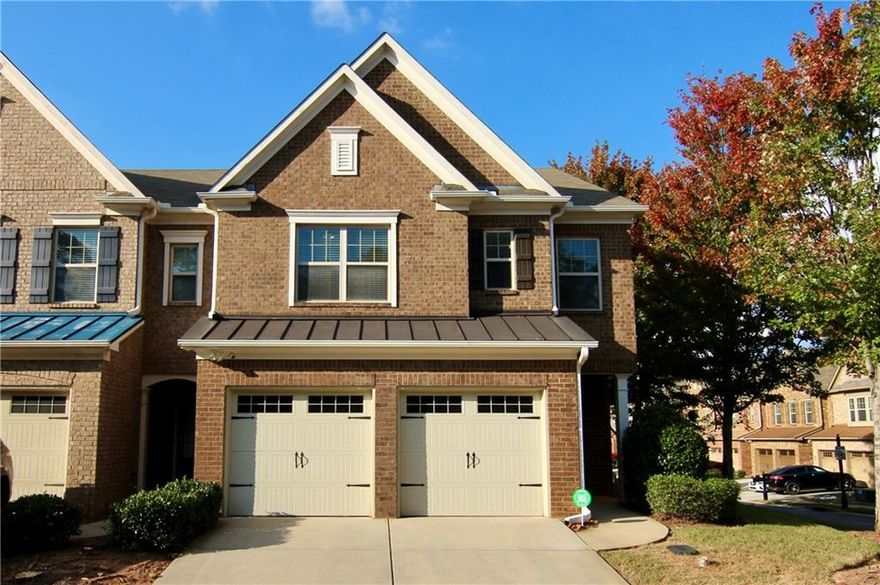 Stunning end unit brick townhome in prime Marietta location. Welcome to this beautifully maintained three bedroom, 2.5 bath end unit in the Caswell Overlook community. This brick townhome boasts a 2-car attached garage, hardwood floors throughout the main level, and a bright, sunny dining area perfect for entertaining. The kitchen features elegant granite countertops, modern appliances, a tile backsplash, and iron stair spindles leading upstairs. Low maintenance living as the landscaping & water is included in your low monthly hoa. The end unit and corner lot provide privacy to your fully fenced rear patio.The upper level features three bedrooms and a bonus room that can easily be used as a home office, media or hobby room. Owner's Suite offers a spa-like retreat with an oversized bath, including a double vanity, separate tub, and shower. Enjoy the convenience of a main floor laundry room located just off the garage entry. Community amenities include a swimming pool and playground, ideal for relaxation and recreation. Located minutes from I-75, Truist Park, Dobbins Air Base, shopping, dining, golf courses, and more, this townhome offers the perfect blend of comfort and convenience in Marietta. Don’t miss your opportunity to make this gorgeous home yours!