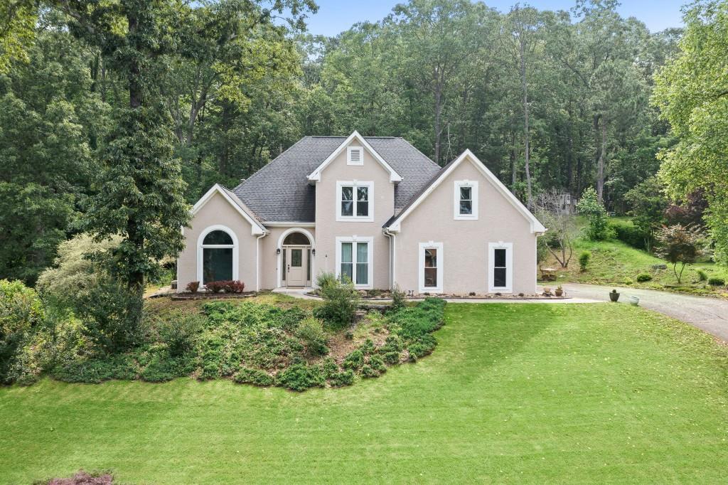 Fantastic Opportunity to Be in the Sought After Swim/Tennis Community of Sweetwater! Wonderfully Renovated 4BR/2.5 Bath Home with All New Windows, Master on Main, Grand Two Story Foyer, Sun Room, Two Story Great Room and Tiled Floors Throughout Main. Vaulted Office/Den on Main. Separate Dining Room w/French Doors, Wainscoting and Chandelier. Chef's Kitchen with Quartz Countertops, Custom Cabinets, Stainless Steel Fridge, Dishwasher, Separate Electric Range, Tiled Backsplash, Pantry and Breakfast Area. Vaulted Sunroom/Keeping Area Off Kitchen with Skylights and Chandelier. Vaulted Great Room with Skylights and Custom Stone Fireplace and Ceiling Fan. Primary Suite on Main with Dual Trey Ceiling and Fan. Upgraded Master Spa with Vaulted Ceiling, Skylights, Custom Vanity with Granite Countertops, Tiled Floor, Jetted Tub, Tiled Shower w/Seamless Glass and Custom Faucets and Light Fixtures. Private Backyard with Flagstone Patio is Perfect for Entertaining and Relaxing. 3 Secondary Bedrooms and Full Renovated Bath Up! This Home is Conveniently Located to Shopping and Habersham Marina.