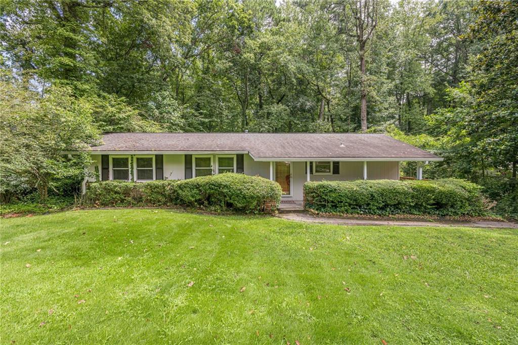 Rare opportunity! Updated ranch in a desired area of Atlanta/Chamblee. Here is a 3 bedroom/2 full walk-in shower bath which also includes a finished basement also with a full bath. This convenient beauty is also nestled on a wooded lot enhanced with a calming brook to complete the setting. Seclusion living with all the amenities close by. If this is not enough to entice your desires - the home also includes many updates such as granite countertops with peninsula breakfast bar, new LVP flooring throughout the main floor, counter depth refrigerator, granite counters in the bathrooms, just to name a few. The updates continue with the "out of site" items such as improved attic insulation, dual fuel heat pump (instant heat, how nice), new water heater with new expansion tank. All appreciated upgrades. Area conveniences are Northside Hospital of Atlanta, Perimeter Center, Murphey Candler Parker, Blackburn Park in North Brookhaven and Keswick Park just to the south. 3671 Cold Spring Lane is a rare gem, nestled in the lush woods of the active and vibrant Atlanta. Hurry! This gem won't last long!