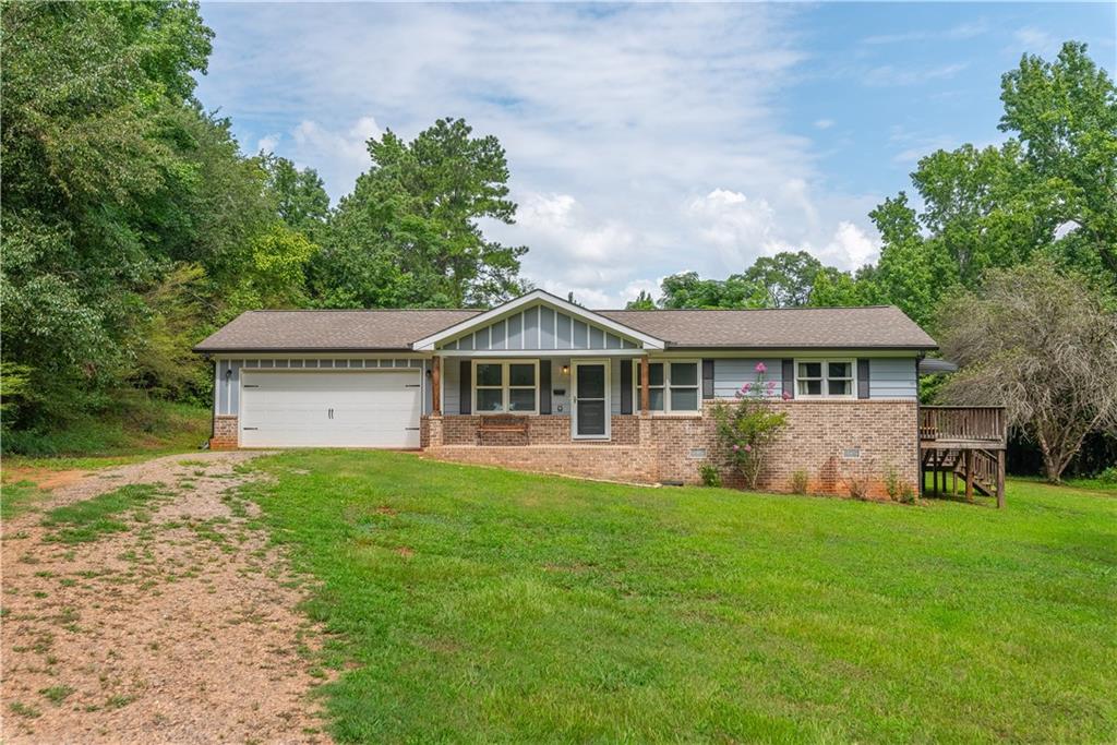 Conveniently located just minutes from Hancock Rd and Willow Springs Church Rd, this beautifully maintained one-level home offers comfort, style, and functionality in the heart of Social Circle.
Featuring 3 bedrooms and 2 full bathrooms, this home boasts an open-concept layout that seamlessly connects the living room and formal dining area—perfect for everyday living and entertaining. The updated kitchen includes stained cabinetry, a stylish backsplash, and stainless steel appliances, creating a warm and modern cooking space.
The primary ensuite offers a tub/shower combo and an updated vanity, while the secondary bathroom features a stand-alone shower. Each bedroom provides ample space and natural light.
The home is serviced by a private well and septic system—both replaced in 2019, offering peace of mind and long-term value.
With its thoughtful updates and desirable location, this home is move-in ready and perfect for anyone seeking single-level living in great neighborhood.
Discounted rate options and no lender fee future refinancing may be available for qualified buyers of this home.