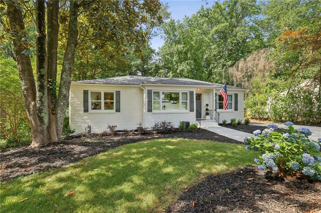 Welcome to this beautifully updated and meticulously maintained 3 bed, 2 bath freshly painted brick ranch nestled on a large, quiet lot in sought-after Briarcliff Heights. Perfectly situated with easy access to I-85, Target, and all the beloved shops and dining of Toco Hills—including the new Fox Bros. BBQ and Wild Heaven Brewery—you will love not just the home but the community too.
Step inside to find a seamless floor plan filled with natural light, rich hardwood floors, and thoughtful updates throughout. The inviting living spaces flow effortlessly into an oversized kitchen featuring abundant cabinetry, generous counter space, walk in pantry, a breakfast nook, and direct access to the back deck—ideal for grilling or enjoying your morning coffee in the privacy of your lush landscaped backyard.
The spacious primary suite features a bathroom complete with double vanity, and separate water closet and a spacious walk in closet. Two additional bedrooms are each well-sized and share a beautifully appointed hall bath adorned with hand-painted wallpaper by the seller, adding a personal and artistic touch.
Recent upgrades include a newer roof, brand-new driveway, fresh exterior and interior paint, and a professionally waterproofed crawlspace that offers plenty of stand-up storage.
This one truly checks all the boxes—style, space, location, and charm. Don’t miss your chance to call it home!