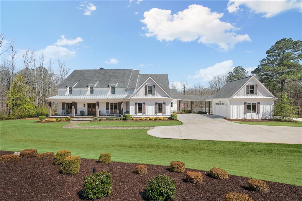 Welcome to Sugar Water Farm, a one of a kind property in sought after Milton. Sprawling property features an approximately 2.5 acre stocked pond, two pastures with custom built chicken coop and donkey house, and a garden with 20 raised beds. Walk inside to the masterfully custom built home with high ceilings, open floor plan, chef’s kitchen and oversized owner’s suite. The screened in porch has stunning views of the large pool, hot tub, fire pit and private pond. Second floor boasts 4 large bedrooms and bathrooms with one bedroom being a second master suite and a separate office. Unfinished basement is ready to be custom finished. Three car garage attached to the house along with a detached 2 car garage with two garage doors so you can pull through. This property has its own node from Comcast so it has extremely fast internet which makes working from home easy. Minutes away from all Crabapple, Downtown Alpharetta and Downtown Roswell has to offer, this property is a must see!
