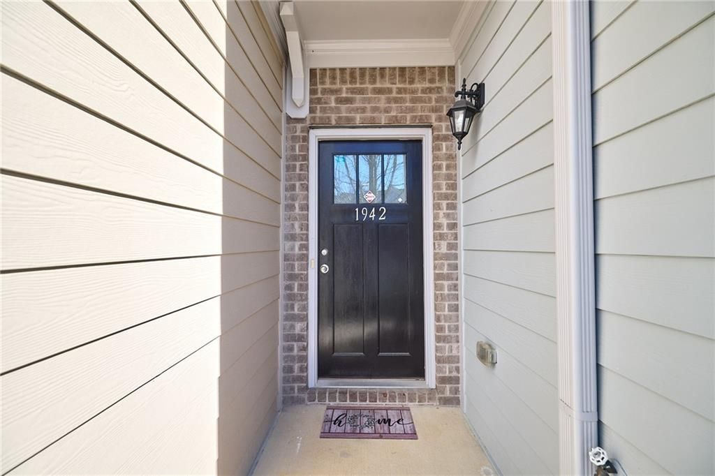 Photo of 1942 Paxton Ridge Ct, Lilburn, GA 30047 (MLS # 7706087)