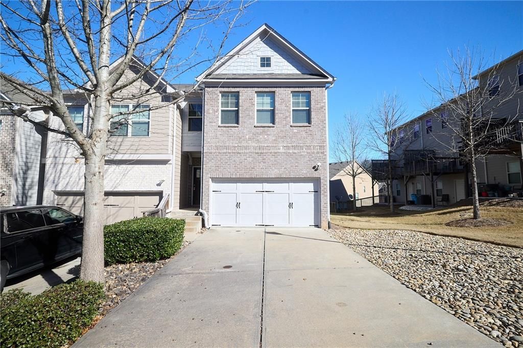 Photo of 1942 Paxton Ridge Ct, Lilburn, GA 30047 (MLS # 7706087)