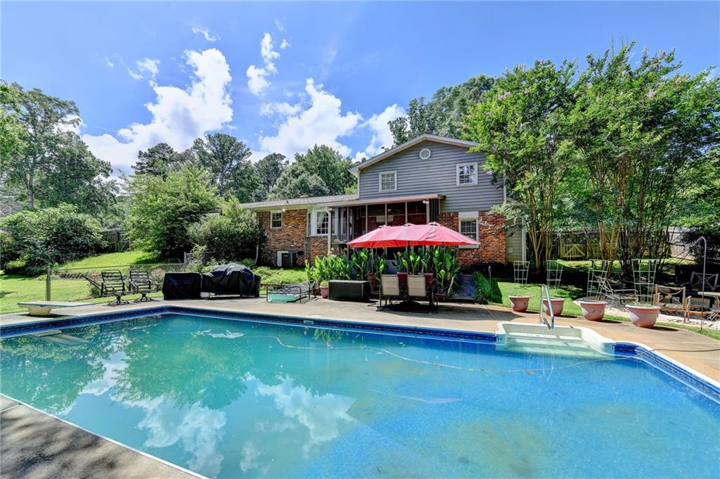 Charming Home with In-Ground Saltwater Pool in Parkview School District!
Nestled in the highly sought-after Parkview School district, this well-built 3-bedroom, 2-bath home offers a perfect blend of comfort, function, and outdoor enjoyment. Step inside to find a formal dining room, a cozy family room with a fireplace, and an additional versatile space ideal for a pool table, reading nook, or game area. The eat-in kitchen, conveniently accessed from the brand-new driveway, overlooks the inviting family room—creating a seamless flow for everyday living and entertaining. Step outside to the showstopping screened-in porch, the perfect spot for morning coffee or evening gatherings, all while enjoying views of the fire pit area and sparkling in-ground pool. The private, beautifully landscaped backyard is a true retreat, complete with fruit trees, a garden area, and lush greenery. Whether you're hosting summer pool parties or relaxing under the stars, this outdoor space is ready to impress. Don’t miss your chance to own this gem in one of Gwinnett’s premier school districts! Welcome Home... The Good Life Awaits!