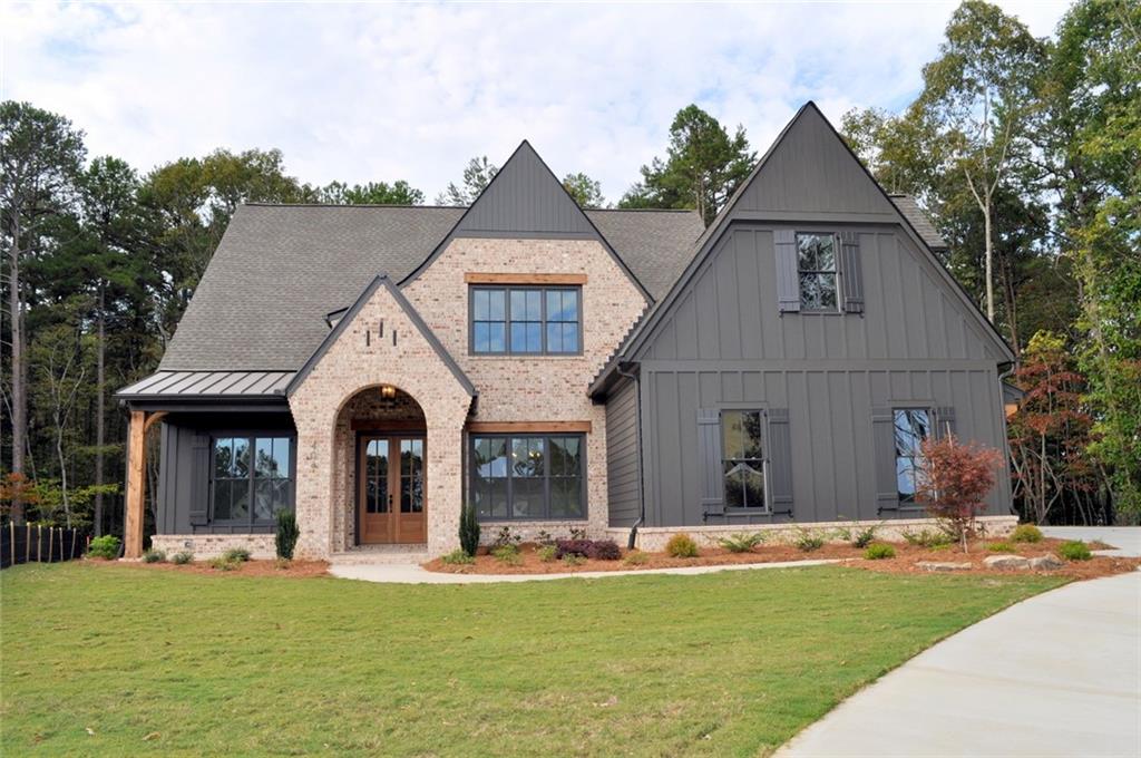 Phase 2 is officially open! Don't miss this exciting opportunity to get in on the ground floor of this beautiful new Bercher Homes community! The Evans E on Lot 2 will include 4BR/ 4.5BA, a bonus room upstairs, 3 car garage, and full unfinished basement. The Evans is an open-concept floor plan that features the Primary Bedroom on the main plus a guest bedroom w/ ensuite! A large family room includes a wall of windows, a wood-burning fireplace, and vaulted ceiling w/ decorative beams. Enjoy the generously sized kitchen with extensive cabinetry that features soft close doors and drawers, Bosch appliances, Quartz countertops, pendant lighting, and more. A huge island is perfect for eating at or displaying that awesome charcuterie board while hosting a party. The Kitchen is open to the adjoining breakfast room and family room. The primary bathroom features a large tile shower with a glass enclosure, raised-height double vanity, a huge walk-in closet, and direct access into the laundry room. Beautiful Hardwood floors on the main floor, upstairs hallways, and loft. 2 large secondary bedrooms upstairs, each with a private bathroom, plus a large bonus room. The brick exterior includes beautiful architectural details, arched entrance, and metal porch roof. Enjoy a covered patio overlooking your private backyard. Double-pane Pella windows throughout. These lots include an irrigation system for the sodded areas of the yard. Three-car garages on all plans. For your peace of mind, we include a Builder's Warranty, a Structural Warranty, and installation of the in-wall Pestban system. Come and experience the Bercher Homes difference. With our design process, this can be the home of your dreams. Pricing does not include buyer-specific upgrades and options. Lot premium may apply. Woodford is at the intersection of Burnt Hickory Rd & County Line Rd, adjacent to the Brookstone Golf & Country Club. Interested but looking for a different home setup? We have 10 unique floorplans available to build in Woodford!
