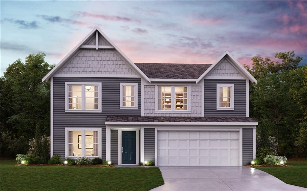 View of front facade featuring a front yard, a garage, and concrete driveway