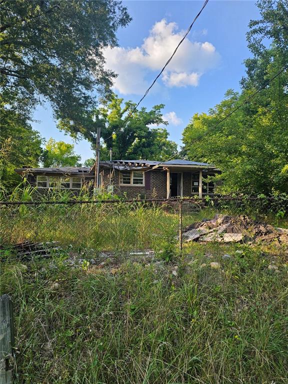 Brick fixer-upper with a solid exterior and foundation. Home is mostly gutted so a creative remodeler will be able to create the home that they want or an investor could create a money generating gem.
Sitting in a quiet, secluded neighborhood, this home can provide the privacy of a country home as well as quick access to all the city offers in 2 short minutes.