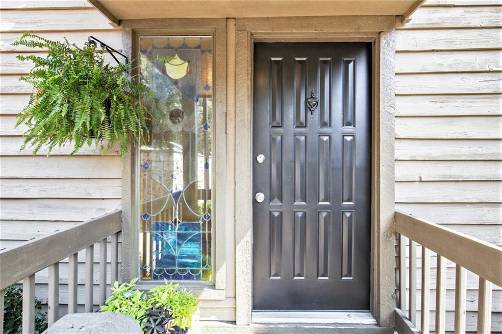 Have a relaxing stroll by a beautiful waterfall, play a fun game of pickleball or tennis, take a dip in the gorgeous pool nestled between the trees….Sounds like a peaceful vacation…OR your newly renovated townhome in the tranquil D’Youville community in the City of Brookhaven just minutes from the popular Chamblee area and classic Dunwoody community! Super close to the Chamblee Rail Trail as well This home has everything your heart desires including: 3 bedroom, 3.5 bath plus a true home office space, extended den with large stone fireplace, new oversized deck for al fresco grilling and dining. Interior dining room has a vaulted ceiling adjacent to thoughtful kitchen renovation which includes Taj Mahal quartzite countertops, Wellborn solid maple wood custom kitchen cabinets, Carrara marble backsplash, updated pendant lights and under-counter lighting and all upgraded appliances. The home also features solid hickory floors, an extended owners suite and has an additional large loft area or 2nd den upstairs with two oversized bedrooms, tons of closet space throughout, fresh paint, new foyer lighting, new vanities, new hot water heater, HVAC, roof and deck replaced in 2024, 2 W/D connections, large utility storage area and 2 car oversized garage. Almost the entire house has been replaced truly so come take a look! One of the largest units in the complex. HOA fees and amenities include: tennis courts, pool, basketball area, large common green lawn, water & sewer, trash pickup, termite & exterior pest control, yard maintenance, all common area, grounds and road maintenance, common area insurance and fire insurance.