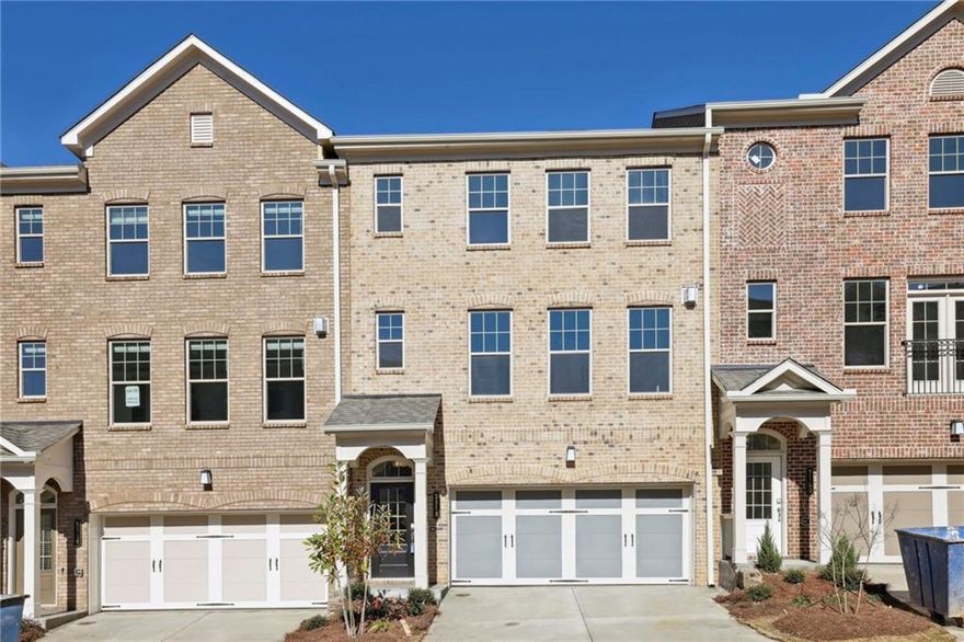 Welcome to Evins Walk and this beautiful 3 story townhome in a gated community in Brookhaven. This spacious, bright open floor plan with 9 ft. ceilings has a host of upgrades. The kitchen includes quartz countertops, stainless steel appliances and more! The chef's kitchen also features an oversized island and a large pantry. There is a separate dining area and living/family room with a fireplace, and a half bath on the main level. Walk out onto your large private deck that has lots of room for seating and entertainment. The primary suite upstairs has a spa like bathroom with an oversized shower and a huge walk in closet. The upstairs floor plan also includes 2 additional spacious bedrooms, a full bath, plus a laundry room which includes a washer and dryer. The terrace level features a 4th bedroom/office/media room with a full bath and a separate entrance that walks out to the backyard. Two care garage with storage space and driveway parking. The community features a swimming pool, fire pit and a dedicated green space. Great location that is convenient to shopping, restaurants and easy access to freeways.