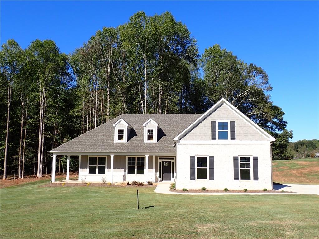 New split bedroom ranch now available in Camden Farms! The Finley plan features a rocking chair front porch and a covered back patio. All on a 1 acre lot!! Formal dining room. Nice family room with brick fireplace is open to the kitchen. Kitchen has an island, stainless appliances, granite tops and a tiled back splash. Great master suite. Master bath with tiled shower and freestanding tub. Split bedroom plan with 3 bedrooms and 2.5 baths on the main and 1 large bedroom and full bath upstairs. This home has a lot of little extras. There is undercounting lighting in the kitchen, fans in all bedrooms, frameless shower door in master bath, framed bath mirrors, spray foam insulation in attic and sprinkler system in the front yard. Camden Farms is a quaint 25 lot subdivision made up of 1+ acre lots. Close to downtown Jefferson. Convenient to Athens and Gainesville.