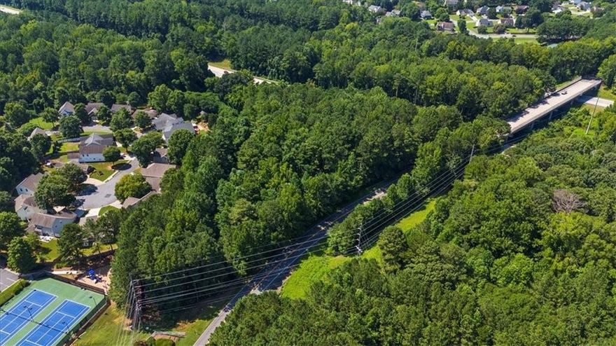 RARE Opportunity to Own 1.46 Acres Land in PRIME LOCATION -Bring your Plans and Builder. Zoned R-40 – (1500 Square Foot Min to 8000 Square Foot Max) One House Only - Septic Tank Only – Triangle or Pie Shaped with 299.27 Road Frontage. Undeveloped Residential R-40 Land. Borders a Swim & Tennis on Left and Backs to a Small Neighborhood and Borders - !-75-North Bound on the Right Side. Not in a floodplain. Previously had a septic tank on property that is no longer in service. Excellent Express Lane Access - less than two miles to Hickory Grove Express Lanes to Downtown ATLANTA, minutes to I-75, I-575, and HWY 92going to Roswell. Near Vibrant Downtown Acworth, Lakes Allatoona, Lake Acworth, Fine Dining to Fast Food, Shopping, Golf, Parks, Dog Parks, Trails, Music Venues, Mall, Outlet Mall, KSU, Sports Complex's, and Hospitals * CENTRALLY LOCATED to CHARMING ACWORTH, KENNESAW, AMAZING MARIETTA SQUARE, CARTERSVILLE, AND LIVELY WOODSTOCK! Proximity to Private Schools and Public Schools of Excellence. NOT in a subdivision, NO HOA! Call and Schedule Your Private Showing Today! Level 3 Soil Environmental Investigative Report/Perc Test Available!