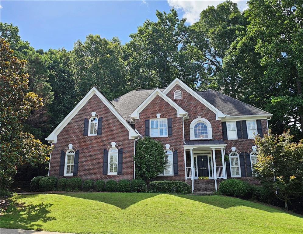 Beautiful brick traditional located in close walking distance to Park Glenn's Swim/Tennis facility and is a short distance from award winning, North Fulton County schools. Avalon, Downtown Alpharetta, Halcyon and the Greenway within easy reach. Home has a welcoming entry with hardwood floors, two story foyer leading to living room and separate dining room. First floor bedroom/office with French doors, palladium windows and adjoining full bath. The two-story charming family has French doors leading to a wonderful sunroom with lots of light coming through. The kitchen is light and bright, making it a pleasure to cook meals. Gas cooking, stainless steel appliances, stone counters, breakfast bar, pantry. Rear stairs lead to the very spacious primary suite with plantation shutters, a sitting area, trey ceiling, two separate bathroom vanities, storage or TV cabinet. Two other bedrooms with jack and jill bath. Upstairs laundry room with utility sink. Finished lower level with large entertainment room, bedroom, full bath and shower, exercise room and unfinished storage/equipment rm. Wonderful outside space, great for entertaining.