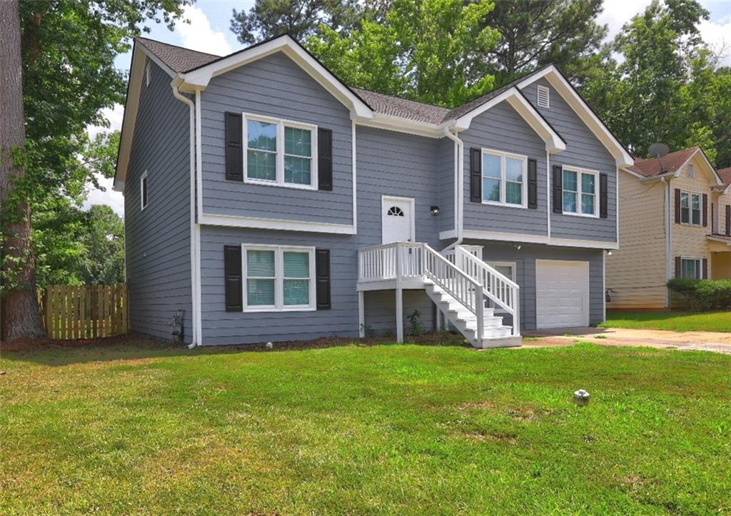 Spacious 5BR/3.5BA Split-Level in Lakeshore Community! Fresh interior & exterior paint, brand-new carpet, 2 years new HVAC system and water heater. Roof approx. 3-4 years old. Step outside to a large, sun-soaked double deck overlooking the private backyard—ideal for weekend gatherings. Optional HOA with swim, lake, trails, clubhouse, and tennis courts. Don’t Miss This Opportunity Whether you're a first-time homebuyer looking for a move-in ready space or an investor wanting to add value through light updates, 821 Shore Drive offers the best of both worlds — Major updates completed, Kitchen & baths need light updates—offered below market with built-in equity for the savvy buyer.