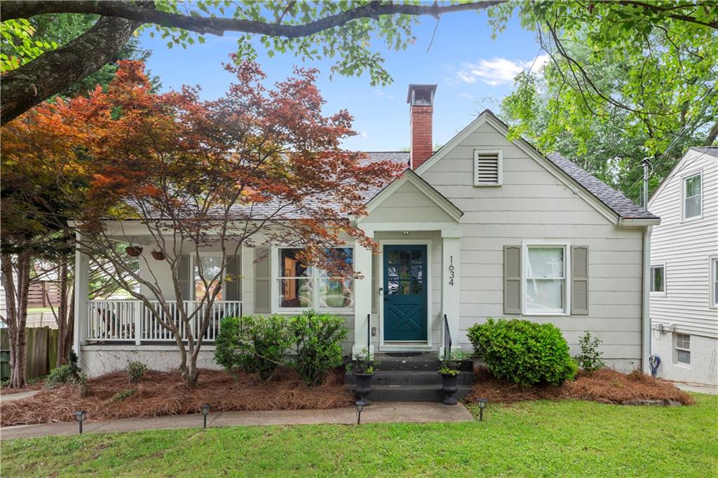 Discover the perfect blend of charm and modern updates in the most perfect location. This delightful 4-bedroom, 2-bath bungalow in East Atlanta Village features a darling front porch, original hardwood floors throughout the main level, and so much more. The inviting fireside living room opens to a generous dining area, and on to an updated kitchen that features granite countertops, a custom tile backsplash, and sleek stainless steel appliances. A charming breakfast bar adds both flair and functionality. Three spacious bedrooms on the main floor offer comfort and convenience, accompanied by a full bath with charming classic tiling. Upstairs, the expansive master suite is your personal retreat with an oversized bathroom complete with double vanities, a walk-in shower. A full, unfinished basement with ample storage awaits your vision. Outside, enjoy the large flat lot on the private patio or terrace, perfect for parking and entertaining with a covered porch and back deck. With newer roof, gutters, HVAC system, and its prime location near East Atlanta Village's vibrant shopping and dining scene, this move-in-ready home is a true treasure. Just moments to some of the best breakfast, lunch and dinners that the city has to offer - don't miss out on this extraordinary find!