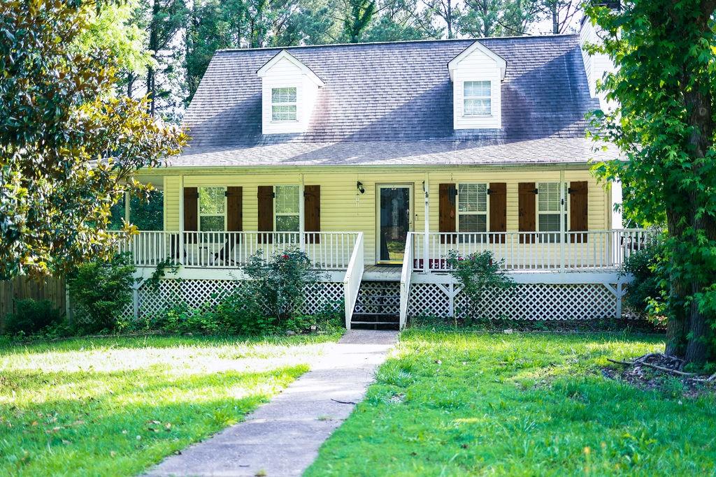 This spacious home is located on a large corner lot. A wrap-around porch and large master on the main with porch access, this home is perfect for your growing family! Let the kids play in the fenced backyard while you sip your favorite beverage on the back deck, or enjoy a movie night in the downstairs media room.