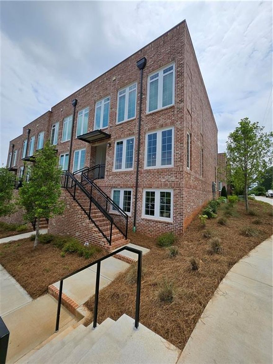 Elevate your lifestyle with this exquisite, barely-lived-in END unit crafted by The Providence Group. This 2-Bedroom, 2-Bathroom Condo is nestled within a meticulously designed and sought after neighborhood where luxury seamlessly intertwines with lifestyle. This charming condo offers a mere stone's throw to vibrant entertainment venues. Indulge in culinary delights at Rena's, Lily's Sushi, and the tempting treats of July Moon at Maxwell Retail. Step inside to discover a very bright, open concept layout flooded with natural light  from expansive front, side and rear windows with 10 foot ceilings.   Premium LVP flooring and fresh, neutral tones create a modern and inviting feel.  The kitchen boasts stainless steel appliances, stunning quartz countertops,sleek white cabinetry, and an expansive island, perfect for hosting gatherings. Relax on the cozy covered deck, ideal for savoring morning coffee or enjoying a glass of wine in the evening. The primary suite is a tranquil retreat featuring a luxurious en-suite with an oversized walk in shower with frameless glass doors, a double quartz vanity  and a  walk-in closet. A second bedroom on the lower level offers privacy and flexibility-ideal for a guest suite, home office, or personal studio. An attached full bath and a dedicated laundry space as well as ample storage space complete the lower level. An attached one-car garage with automatic garage door and  driveway for guest parking ensure ultimate convenience. The Maxwell community offers an array of amenities, including a pool, cabana, bocce ball court, and firepit, with convenient access to the Alpharetta Loop. Enjoy the peace of mind of HOA-maintained exterior and common spaces, along with the convenience of being just two blocks from the heart of Downtown Alpharetta. With City Center within walking distance and Avalon,  and Highway 400 approximately one mile away, The Maxwell offers the perfect blend of luxury, convenience, and community living.
Whether you're enjoying the Saturday Farmers Market or exploring downtown's shops and restaurants, this condo delivers the best of modern urban living.