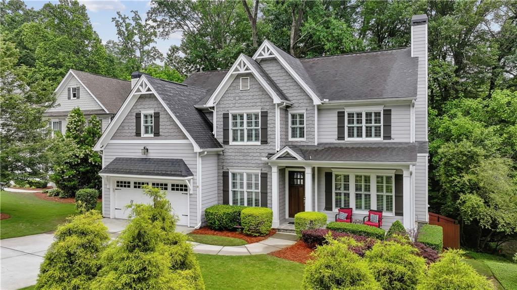 Meticulously cared for and updated Drew Valley/Ashford Park Elem. colonial with custom wood trim and hardwood floors throughout the main and all new hardwood floors on the 2nd floor bedrooms. The first floor features high ceilings and a living room with a custom coffered ceiling, canned lights, and a large fireplace. Separate dining room plus dinette area is a modern kitchen with lots of custom cabinets, granite counter-tops, a kitchen island, stainless steel appliances, plus a walk-in pantry! The dinette area leads to a rear yard deck overlooking a partially wooded area for privacy, plus a grassy, stockade-fenced-in area great for pets.
The first-floor bedroom has easy access to a full bath and makes a great room or office. The 2nd floor features 4 nice size bedrooms, all of which have access to a full bathroom! The luxury bedroom suite features a tray ceiling, a huge walk-in closet with custom shelving, a luxury bath with a raised double vanity, a separate shower, and a tub in a vaulted ceiling bathroom. The 2nd floor also features a laundry room with lots of workspace. The walk-out finished lower level is great for media and a game/rec room with a wet bar with ice maker and wine refrig., It walks out to the rear yard, covered by a paver stone patio under the deck for plenty of shade. A must-see!