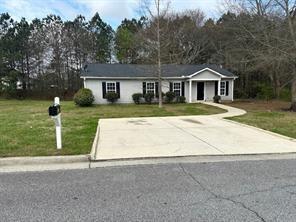 This charming 4 bedroom, 2 full bath single family home sits on a level spacious lot and is conveniently located to shopping and hospital.
The primary bedroom includes ensuite bathroom and walk-in closet. Updates include newer roof, hardwood floors and paint. Stainless steel refrigerator and cooktop oven. Updated kitchen includes a pantry. Exterior storage room great for lawn equipment or other storage items. Washer and dryer included and lawn care can be provided for additional $100/month. Two off street parking spaces. Rental App fee is $100.00 per family. Housing vouchers not accepted.