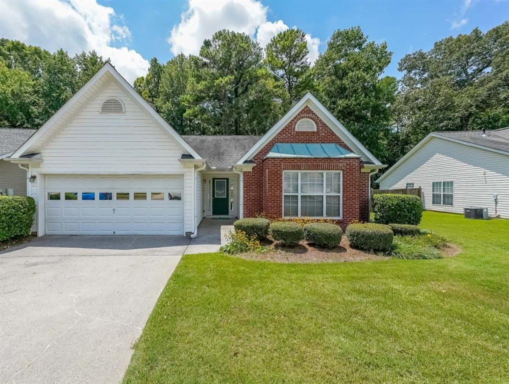 True One level living in sought-after Liberty Commons Swim/Tennis Community. Just minutes from downtown Kennesaw and downtown Acworth. Shopping is right around the corner, as well as a library, resturants, schools, Swift Cantrell Park, and more. This ranch style home boasts maintence free exterior of brick and vinyl, new luxury vinyl flooring throughout, numberous vaulted ceilings, and a split bedroom plan. There are three bedrooms and one of those rooms has a huge oversized window making it a great room for an additional den or office. The kitchen has a new gas stove and is flanked by a eat-in breakfast area and a more formal area serves as a dining room. The large family room has soaring ceilings, a fireplace and gleaming new flooring. The owner's suite is in the back of the home and features ensuite with garden tub and separate shower as well as double vanities and a walk-in closet. The main living area has loads of light with large windows overlooking a patio and with a view of a lovely wooded area. Additional features include: All plumbing pipes have been replaced. Fridge -8 yrs young, dishwasher has been replaced, new roof in 2017.