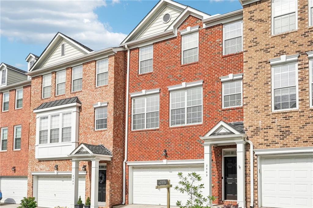 Updated Townhome with Finished Basement & Dual En-Suites in a Sought-After Atlanta Community. Welcome to this beautifully maintained and thoughtfully updated home with a finished basement, ideally situated in a vibrant Atlanta community featuring resort-style amenities including a clubhouse, fitness center, and sparkling pool, perfect for enjoying a connected and active lifestyle. Classic brick front, covered entrance, driveway, and a two-car garage. Located just minutes from shopping, dining, parks, schools, healthcare, and major highways, this home offers an easy commute and all the essentials at your fingertips. Step inside to an open-concept main level designed for both comfort and entertaining, featuring vaulted ceilings, dedicated dining areas, and a cozy fireplace to anchor the living space. The peninsula-style eat-in kitchen is equipped with granite countertops, a breakfast bar, and stainless steel appliances. A private deck just off the main living area is ready to be customized. Upstairs, the primary suite impresses with a large walk-in closet, dual vanity, elegant fixtures, and a stunning frame-less tile shower with a rainfall shower head. A second spacious en-suite offers a soaking tub and walk-in shower, ideal for guests or roommates. An additional full bedroom and a convenient upstairs laundry room round out the upper level. The finished basement provides a flexible layout for multi-generational living, a roommate setup, or creative space customization, featuring a spacious open bedroom, a full bathroom, and walk-out access to a covered patio. This townhome delivers space, style, and versatility, all in a well-appointed community that’s close to everything Atlanta has to offer. Close proximity to to I-75, I-285, Vinings, Buckhead, Midtown, and within walking distance to The Battery and Braves Stadium. This move-in ready home combines luxury, convenience, and peaceful nature views in one of the most desirable areas around.