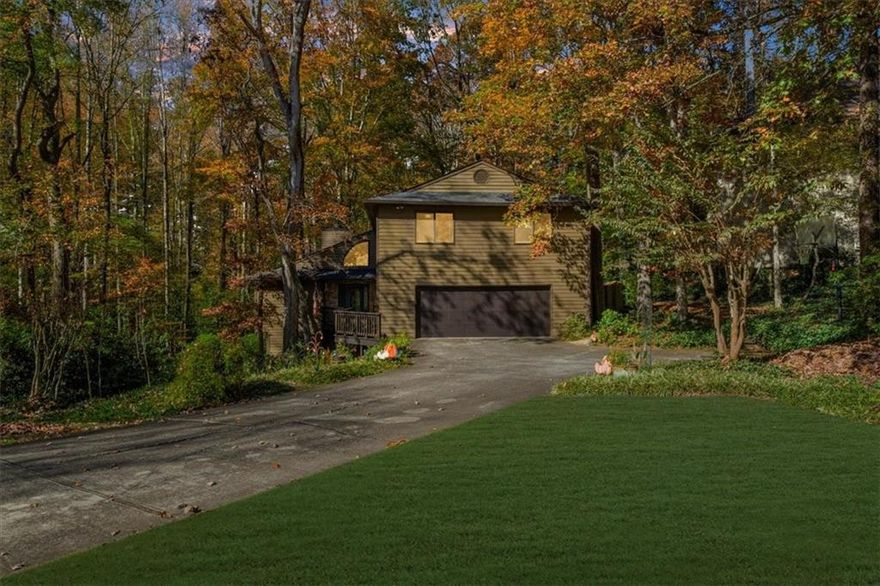 Discover a home where modern comfort meets serene seclusion on a sprawling wooded estate. Inside, expansive living spaces greet you with vaulted ceilings, abundant natural light, and a flowing open layout designed for both everyday life and entertaining. The family room, anchored by a sophisticated fireplace, connects effortlessly to a formal dining area and a versatile flex space. The eat-in kitchen features a granite-topped island, ample cabinetry, and generous countertops—perfectly balancing style and function while creating a natural gathering spot for family and friends.
The primary suite offers a private retreat with a spa-inspired bath, including a jetted tub, separate shower, and a generous walk-in closet. Three additional bedrooms upstairs provide space for family or guests, while the finished basement serves as a full second living area with a kitchenette, modern bath, and flexible rooms that can adapt to your lifestyle.
Step outside to your own woodland sanctuary. Expansive decks provide seamless indoor-outdoor living, ideal for entertaining or unwinding while surrounded by towering trees and the calming sounds of nature. With deer, birds, and other native wildlife often passing through, this property truly feels like a private nature preserve. A secluded fire pit area offers a peaceful escape, and the gently rolling terrain enhances the sense of space and tranquility.
Perfectly situated near Mabry Park and Leita Thompson Park, this home offers easy access to scenic walking trails, open green spaces, and outdoor recreation. Located in the sought-after Lassiter High School district, with convenient access to shopping, dining, and major highways, this residence combines elegant living, unmatched privacy, and the beauty of nature—all in one extraordinary setting. The community also features two pools, tennis courts, and a lake to enjoy!