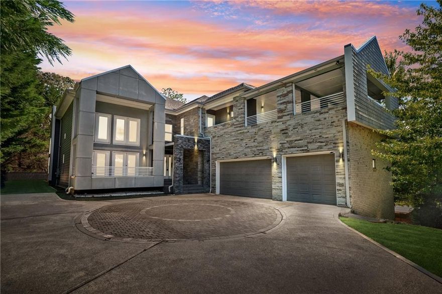 Welcome to this striking contemporary residence, where thoughtful design meets gracious living in a blend that feels both luxurious and warm. As you step into the dramatic two-story great room, walls of windows draw in natural light, while crisp architectural lines and soaring ceilings create a gallery-like strength tempered by comfort. A flexible layout features two kitchens and a welcoming guest bedroom on the main level, making entertaining and daily living both comfortable and convenient. With ample garage space for three vehicles, this home is as practical as it is beautiful. Step outside from the dining room onto the covered back patio, leading to the beautifully landscaped backyard and a charming gazebo—ideal for quiet afternoons or starlit gatherings. Downstairs, the fully finished basement includes an in-law suite with its own full kitchen, an exclusive exterior entry, and an interior entry—perfect for extended family, guests, or a private workspace. The basement also boasts a media room equipped with WiFi projector and a huge 16’ wide projection screen, creating a premium home theater experience. Upstairs, the expansive master suite is a phenomenal retreat: custom shelving, an impressive custom-built walk-in closet, and a spa-level bath that showcases a frameless glass shower and a soaking tub. You’ll love stepping out onto the massive covered deck off the master suite, where morning light and evening breezes mingle above your private, lushly landscaped yard. Every room is designed with lifestyle in mind, from quiet nooks with light streaming in to open entertaining zones that flow naturally. The home was crafted to deliver both grandeur and coziness. Just outside your door, you’ll discover a host of nearby recreation and local treasures. The nearby Sewell Mill Creek Loop in East Cobb Park provides an easy walking trail under tree canopies, perfect for daily strolls or birding. The historic Strand Theatre in Marietta offers live performances, classic films, and cultural events in a beautifully restored atmosphere. This home offers an exceptional balance: bold, contemporary architecture with inviting spaces; indoor sophistication with seamless outdoor living; and a prime location that places you minutes from nature, culture, and the charm of Marietta.