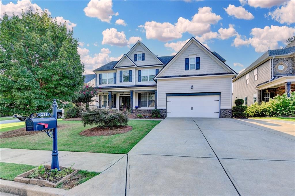 Amazing 6-bedroom / 5 bathroom home on finished basement in Lakestone, a highly sought-after lake community! Picturesque community - Great yard distance between neighboring homes with sidewalks throughout. Roof replaced in 2024. Covered front porch opens to two two-story entry with formal dining room and living room. Huge gourmet kitchen with stainless steel appliances, Gas Cooktop, Solid Surface countertops, Oversized Island w/Seating, White Cabinetry, Tile Backsplash, Breakfast Area, and a Roomy Pantry. Guest Bedroom with Full Bath on Main. Hardwood floors entire main level, master bedroom, upstairs hallway and bonus room. Owners suite leads to the updated Spa-Like Master Bathroom with frameless shower glass, dual vanities, tile floors, and a walk-in closet. Two bedrooms upstairs w/Jack-n-Jill bath, a third secondary bedroom with private bath, and a bonus room (could be converted to 7th bed/office/master sitting area). Convenient 2nd-floor laundry room. Finished basement offers a kitchen, bedroom, bathroom, recreation room, and laundry area. Deck has gas line ready for your BBQ. Level driveway with a 3rd car driveway for additional parking. Tranquil level fenced back green yard. Award-winning River Ridge HS district. Come enjoy Lakestone's amenities: Jr Olympic pool, fenced toddler pool, restroom cabana, picnic area, playground, tennis courts, pickleball courts, lakeside park w/trail, & stocked lake for resident catch & release fishing. Bring your kayak. Walk to shopping, dining, coffee, etc! Minutes to trendy Downtown Woodstock! Easy drive to Roswell, Alpharetta, Marietta, GA400, as well as Kennesaw, Canton, I-575 & I-75! MOVE IN READY!
