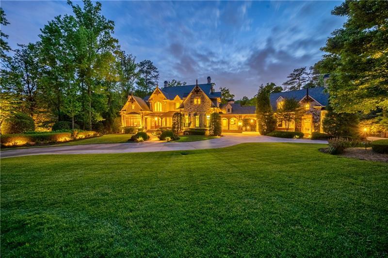 Private gated estate on 3.15 acres. Beautiful grounds offer resort-style outdoor living with covered patios and porches, an outdoor kitchen, heated pool & spa and outdoor fireplace. Grand entrance with sweeping staircase leads to an open floor plan with large rooms and high ceilings, perfect for entertaining. Stunning, Great Room, limestone fireplace, coffered ceiling, and wall of windows with glass doors leading to the covered veranda. Gourmet Kitchen which opens to the Light-Filled Keeping Room. Luxurious main level master suite with fireplace, morning bar and sitting area. Closet to die for.. Spa master bathroom with double vanities, large walk-in shower and soaking tub. Upstairs boast 4 ensuite bedrooms and large family room. Huge Terrace Level with theater, billiards area,bar, recreation room,craft room, bedroom and gym, sauna, steam room and more. Separate au pair apartment with kitchen, sitting area, bedroom and full bathroom.(Au Pair apartment not counted in the bedroom count) Mature landscaping throughout and level manicured grassy areas perfect for a game of soccer. The heated saltwater pool features a water-slide and large sunbathing area. whole house generator, well, Parking for 20+ cars. Elevator Company confirmed that there is a spot to add an elevator.