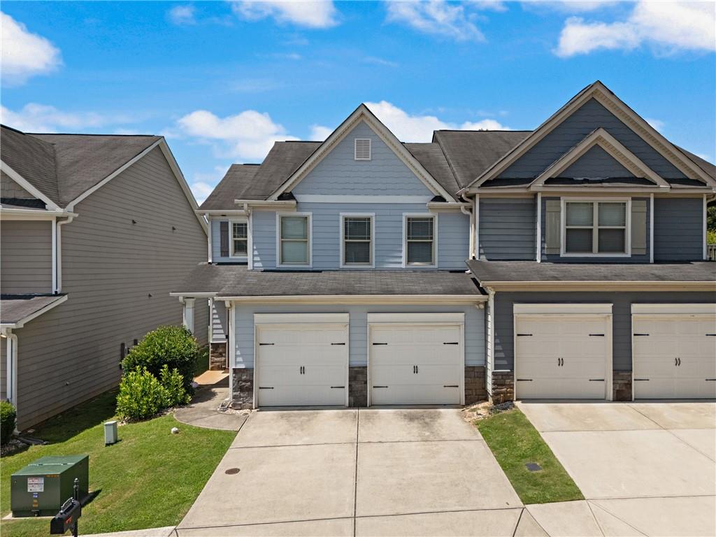 Welcome to this beautiful 3-bedroom, 2.5-bath townhome nestled in the sought-after Villages at Brookmont community! Step into an inviting open-concept floor plan featuring a spacious living room, updated kitchen with stainless steel appliances, and a cozy dining area perfect for entertaining. Upstairs, enjoy a large primary suite with a walk-in closet and private bath, along with two additional bedrooms and laundry. This well-maintained home also offers a private backyard space steps away from Community amenities and attached 2 car garage. Conveniently located near shopping, dining, and I-20. Community amenities include pool, tennis courts, playground, and clubhouse. Ideal for homeowners or investors—no rental restrictions!