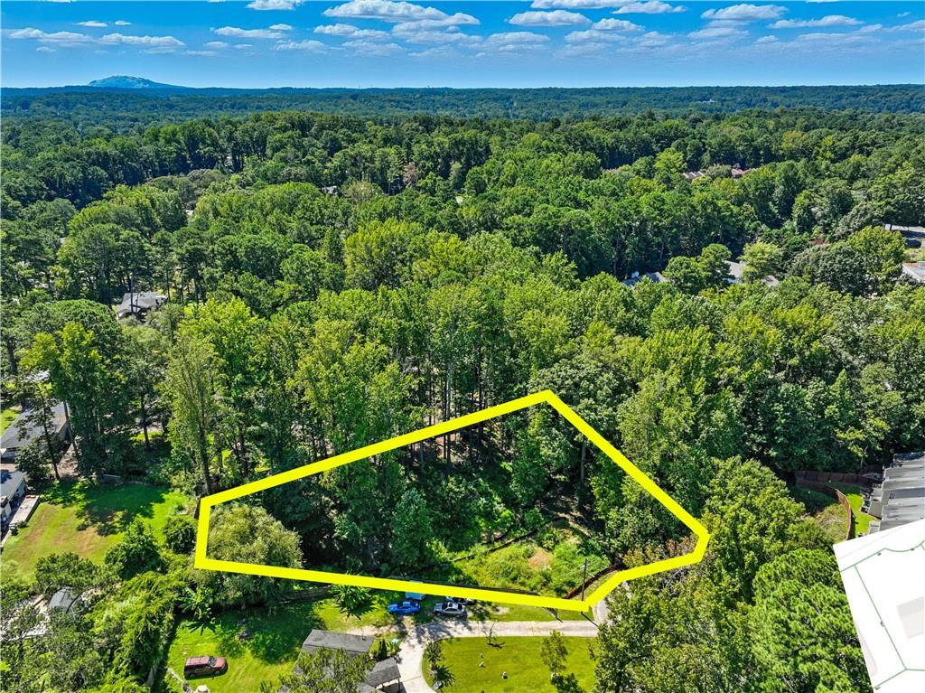 This beautiful 0.69 acre piece of land offers an incredible opportunity to build your dream home in one of the most convenient and desirable areas. Just two minutes away from Jimmy Carter Boulevard, you'll have quick access to all your favorite restaurants, stores, and salons, with many shops even within walking distance. The property sits in a central location that still provides a quiet and private setting, making it the perfect balance of convenience and comfort. The land has already been surveyed and is clearly marked on the property, with a full fence around it that makes it easy to see the boundaries. It is not located in a flood zone, which means it's completely buildable, and the current R75 zoning makes it perfectly suited for a new home. Utility connections such as electricity, water, and public sewer are easily accessible, saving you time and costs when preparing to build. Situated right on a cul-de-sac, the property provides a safe and peaceful environment with minimal traffic. With no HOA, you'll enjoy the freedom to design and build without restrictive community rules. This is truly a great area to create the home you've always envisioned. Don't hesitate to visit and see for yourself what makes this property such a unique opportunity.