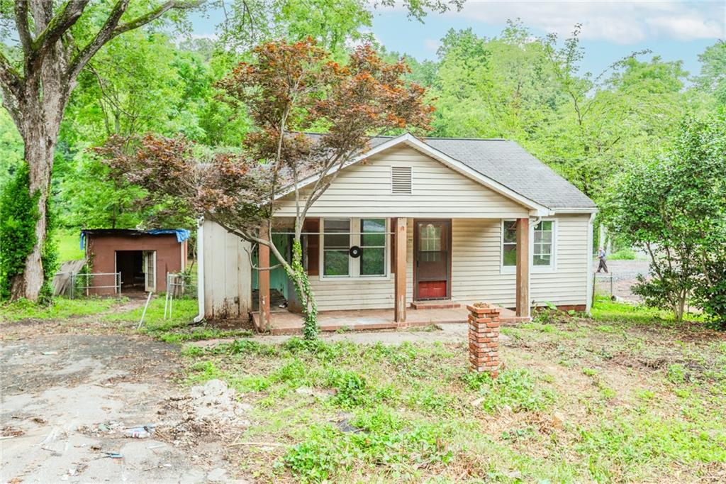 Investors, builders, and visionaries — don’t miss this opportunity. This 3-bedroom, 1-bath ranch on a level lot in one of DeKalb’s fastest-growing neighborhoods. Featuring a true ranch layout, crawl space foundation, and a private owner’s suite, the home is the perfect canvas for a high-return transformation. Just 5 miles from the Atlanta BeltLine and steps from Gresham Park’s gym, pool, and scenic trails, the location offers unbeatable access to top amenities. Surrounded by ongoing development and quality renovations, this property is well-positioned for significant after-repair value. Bring your vision — the potential here is undeniable.