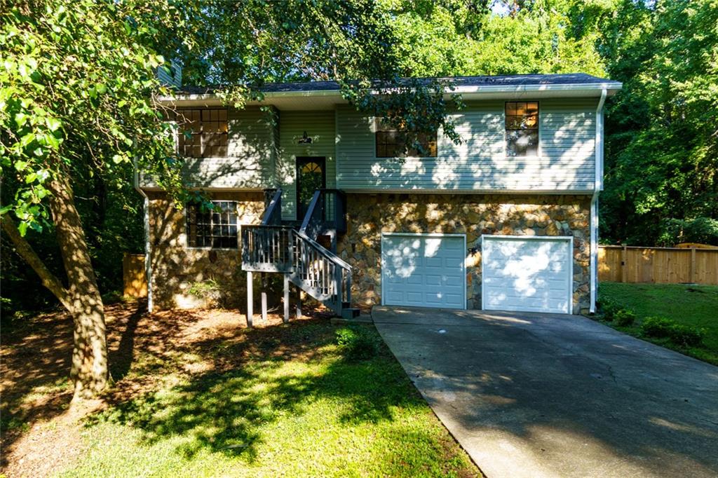 Welcome to your dream home! This fully renovated gem combines timeless craftsmanship with modern style, perfectly situated in one of Acworth’s most sought-after neighborhoods. Located just minutes from Kennesaw State University, top-rated schools, shopping, dining, and major commuter routes, this home offers both convenience and charm. Step inside to discover a thoughtfully executed full flip, showcasing designer finishes throughout. The spacious floor plan boasts custom touches in every corner—including a beautifully built custom closet addition offering both function and luxury. Entertain with ease on the extended back deck, complete with a newly added staircase that flows seamlessly into the landscaped backyard—ideal for hosting, relaxing, or simply enjoying the outdoors.
Meticulous attention to detail and quality craftsmanship make this home stand out. From the upgraded fixtures to the rich flooring and stylish finishes, every inch has been curated to impress.
Whether you're looking for a smart investment or a forever home, 1172 Ridgeside Drive checks every box.