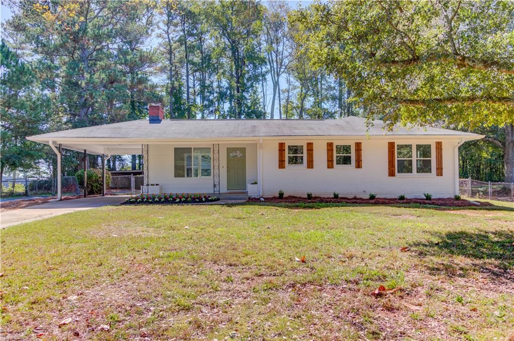 This charming completely RENOVATED 3 bedroom , 2 bathroom brick ranch is ready for the holidays! NEW KITCHEN! NEW BATHS! NEW FLOORS! NEW APPLIANCES! NEW EVERYTHING! This open floor plan gives cooking enthusiasts the ability to prepare meals while mingling, and enjoy the breakfast bar with quartz countertops, and 2 large picture windows with views to the LARGE BACKYARD ! A versatile outbuilding gives endless possibilities for storage or even.a workshop! The fully fenced OVERSIZED, FLAT yard provides private space for outdoor activities. This PRIME location is located near great restaurants ,shopping, schools and Downtown Tucker, La Vista, Briarcliff ,I-285 and I-85.