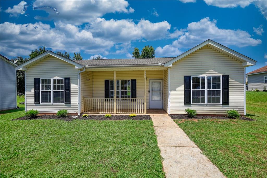 Remodeled step-less ranch in the desired Social Circle school district and close to downtown! Brand new roof, new Luxury vinyl plank flooring through out the home. Fresh paint. Open floor plan. Large master bedroom features walk-in closet and private master bathroom! Two spacious secondary bedrooms share another full bathroom! Adorable rocking chair front porch & rear patio. Private backyard. 100% USDA financing available! FHA eligible 9/11/25. Please call to schedule your private tour today!