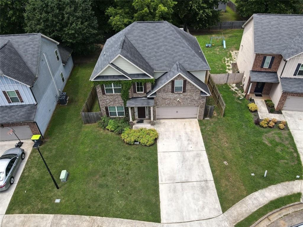 Welcome to your next chapter in the heart of McDonough! This spacious 4-bedroom, 2.5-bath home sits on a quiet street in a well-established neighborhood—offering the perfect blend of Southern comfort, flexible living space, and investment opportunity.Step inside and you’ll feel the warmth of a home that has been filled with life, love, and laughter. While it may not be brand new, this home offers something far more valuable—solid bones, generous square footage, and endless potential to make it your own.The open-concept layout flows effortlessly from the living room to the kitchen, ideal for entertaining or cozy nights in. Upstairs, the oversized owner’s suite features a walk-in closet and a private bath—your personal retreat after a long day. The fenced backyard is perfect for summer barbecues, pets, and playtime, while the two-car garage adds function and convenience. Whether you’re a first-time buyer, relocating to the Atlanta metro, or a savvy investor seeking a home with great upside—this is a hidden gem worth the visit.